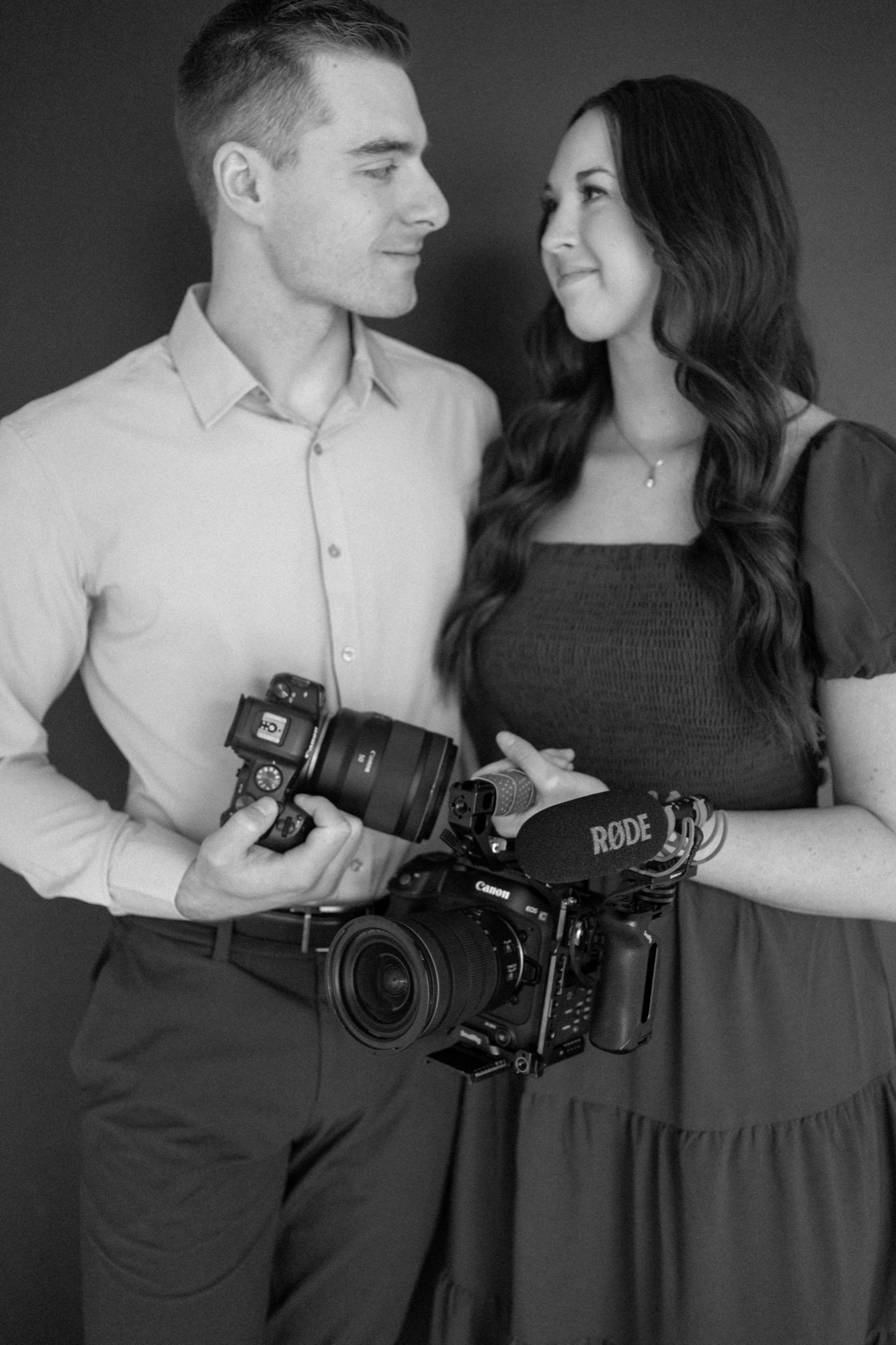Isaac and Liv with their cameras, black and white